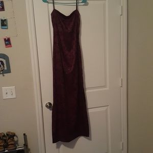 A dark purple dress with black designs